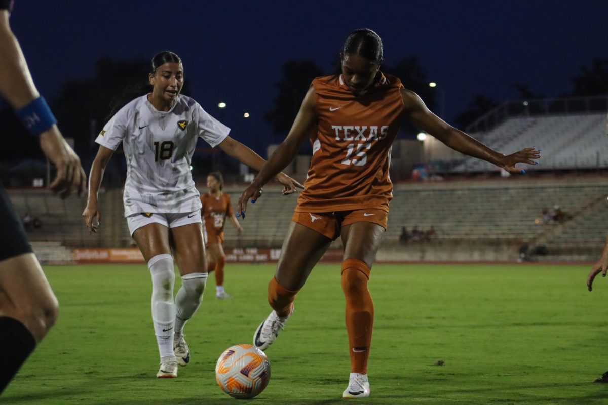 Forward Trinity Byars prepares to kick the ball away from an opponent on Sept. 28, 2023 during the game against WVU.