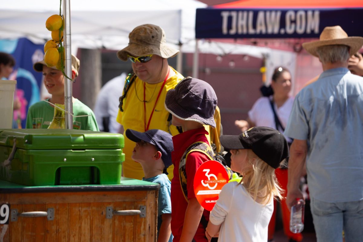 Festivalgoers get lemonade as heat soars at the biannual Pecan Street Fest in downtown Austin on Saturday, Sept. 14, 2024.