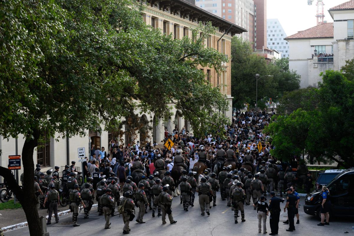 Law enforcement channels protesters past Sutton Hall on April 24, 2024 during the pro-Palestine protest.