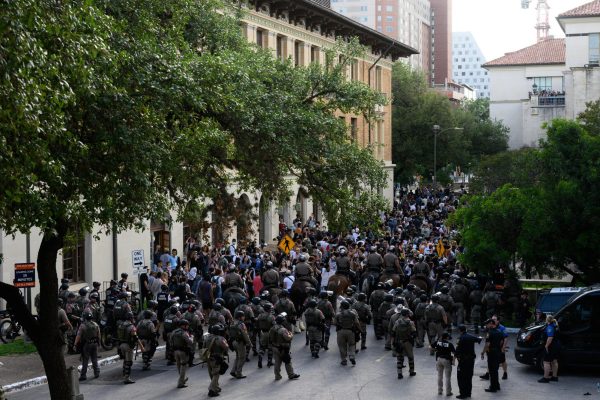 Law enforcement channels protesters past Sutton Hall on April 24, 2024, during the pro-Palestine protest.