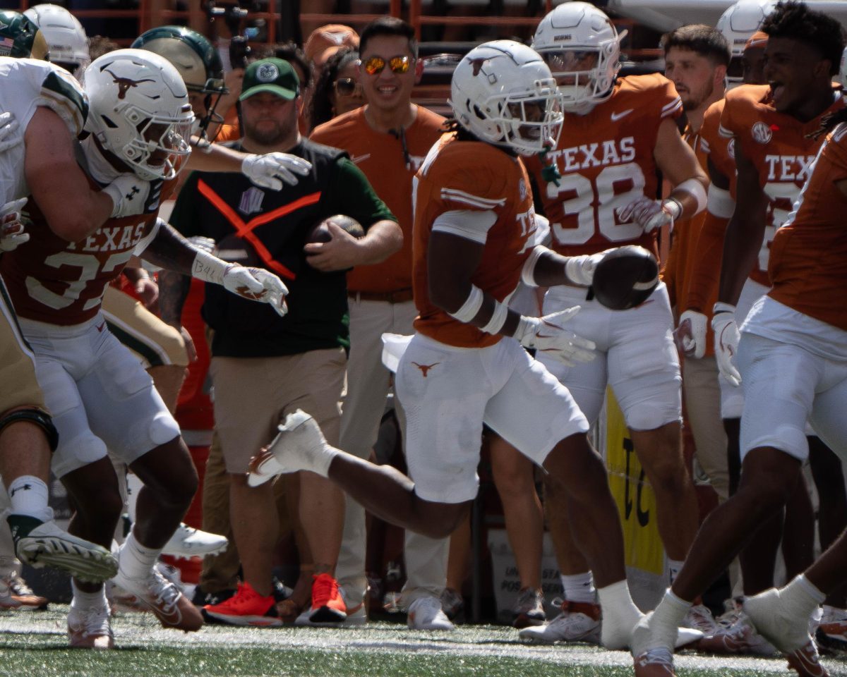 Senior defensive back Jahdae Barron runs the ball downfield after intercepting it during Texas' game against CSU on Aug. 31, 2024. 