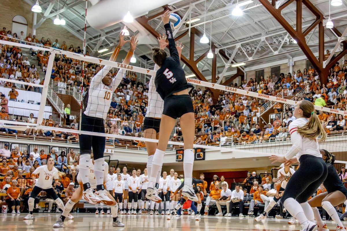 Reagan Rutherford and Ayden Ames block the ball, scoring the 13 point in Texas' third set against Houston on Wednesday Sept. 11, 2024. The Longhorns won the set 25-20 and the match 3-0.