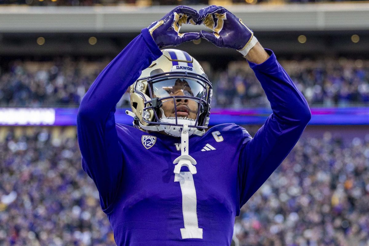 University of Washington wide receiver Rome Odunze acknowledges the crowd after catching a pass for a touchdown during UW's game against Washington State University on Nov. 25, 2023 at Husky Stadium in Seattle, WA.