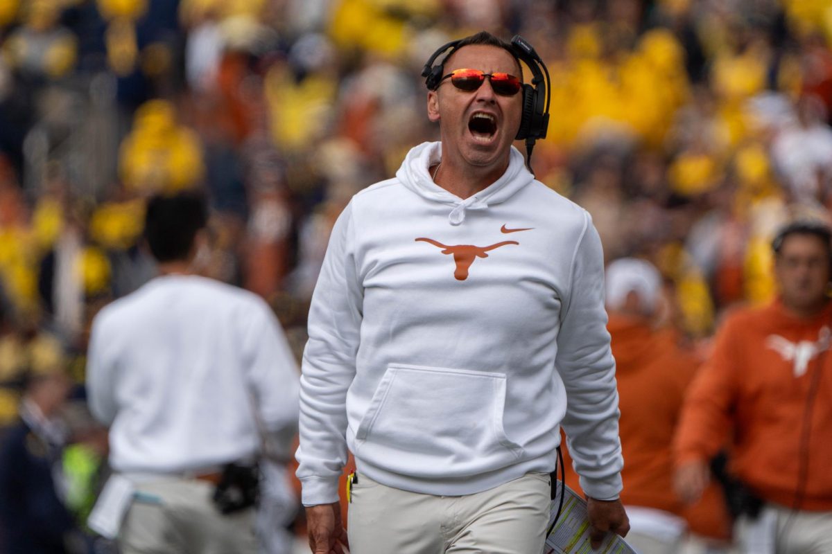 Head coach Steve Sarkisian yells at the Texas fans to cheer more during the final minutes of Texas' game against Michigan on Sept. 7. 