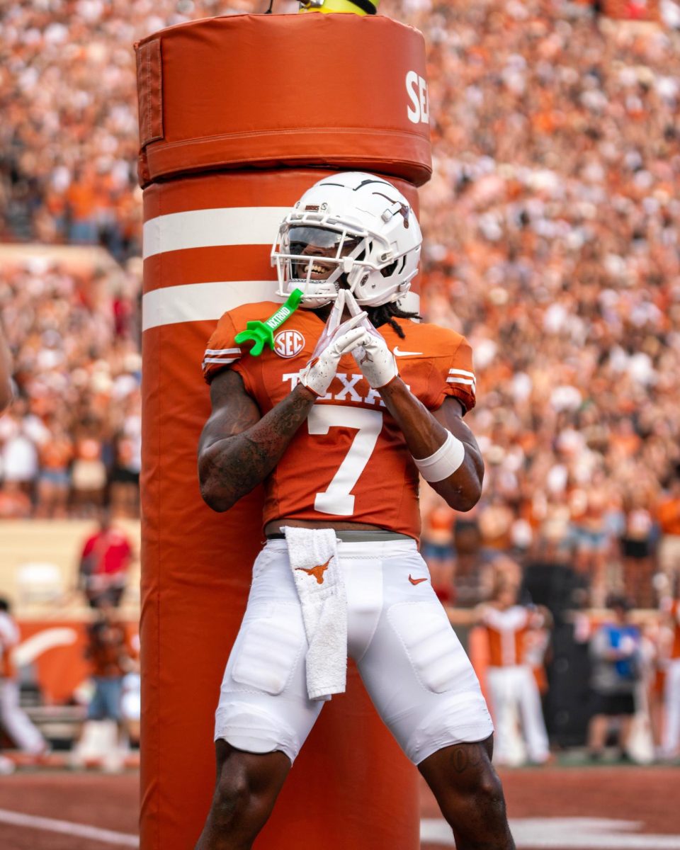 Junior wide receiver Isaiah Bond celebrates a touchdown with an homage to the movie character "James Bond" with a finger gun during Texas' game against UTSA on Sept. 14, 2024. 