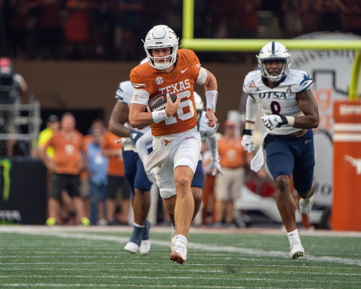 Redshirt freshman quarterback Arch Manning runs the ball downfield for a 67-yard rushing touchdown during Texas' game against UTSA on Sept. 14, 2024. 