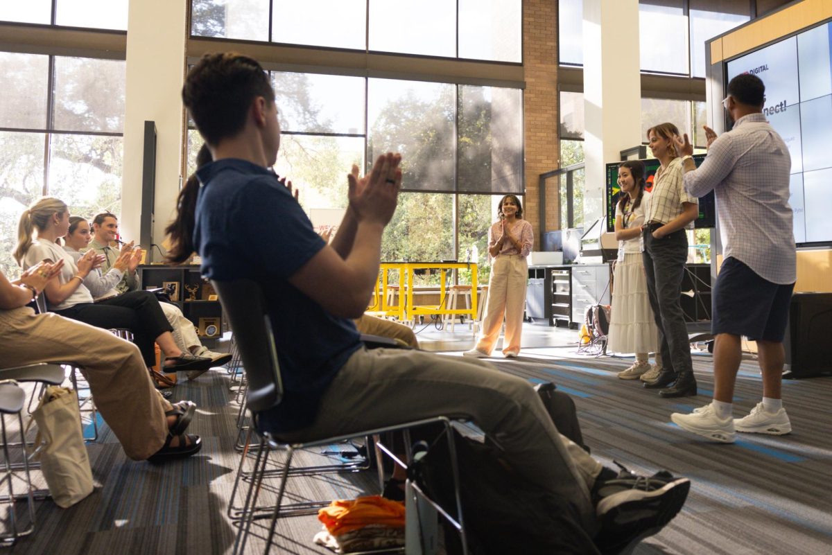 The audience applauds the founder of Career City Limits, Jamil Hooper, and the four speakers from HEB Digital on Wednesday Sept. 4, 2024. From left to right, Maria Rodriguez, Emily Do, Claren Moyers, Jamil Hooper, and Alyssa Zuniga Patel who joined the panel via Zoom.