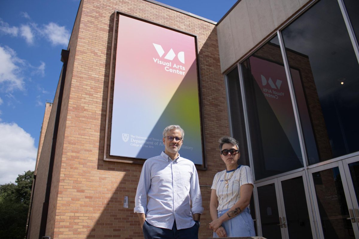 Artist Violette Bule and Art Historian Michel Otayek stand for a portrait outside the Visual Arts Center Thursday.