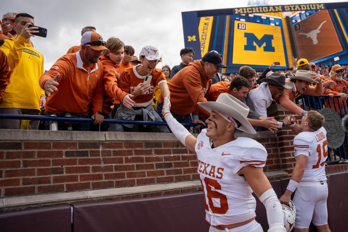 Defensive back Michael Taaffe high fives fans after Texas win in Michigan on Sept. 7, 2024. 