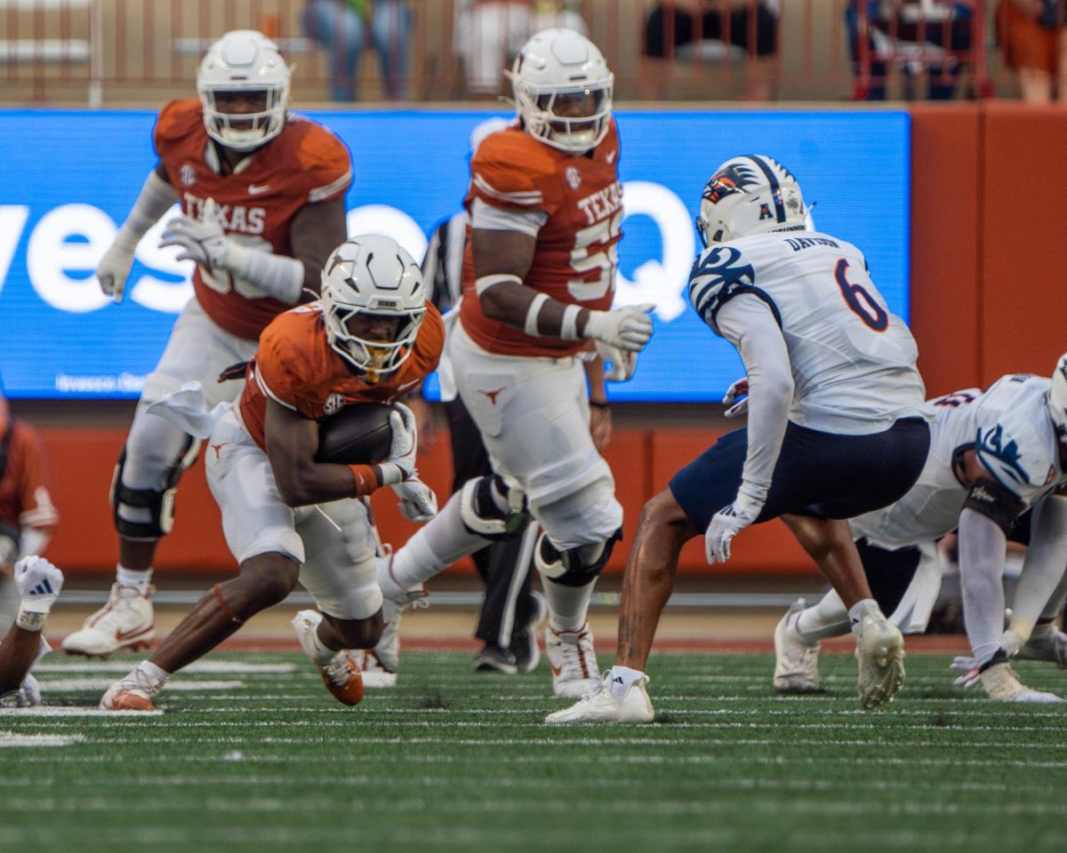 Sophomore running back Quintrevion Wisner makes a play during Texas' game against UTSA on Sept. 14, 2024.