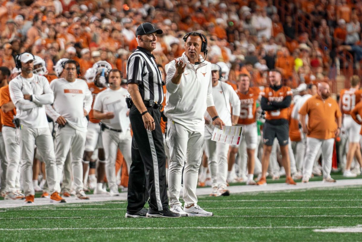 Head coach Steve Sarkisian talks to a ref during Texas' game against ULM on Sept. 21, 2024.