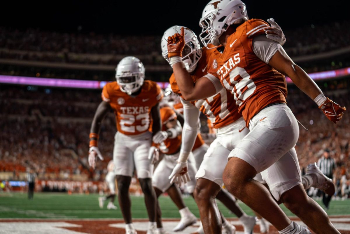 Sophomore linebacker Liona Lefau celebrates a safety with his teammates during Texas' game against ULM on Sept. 21, 2024. 