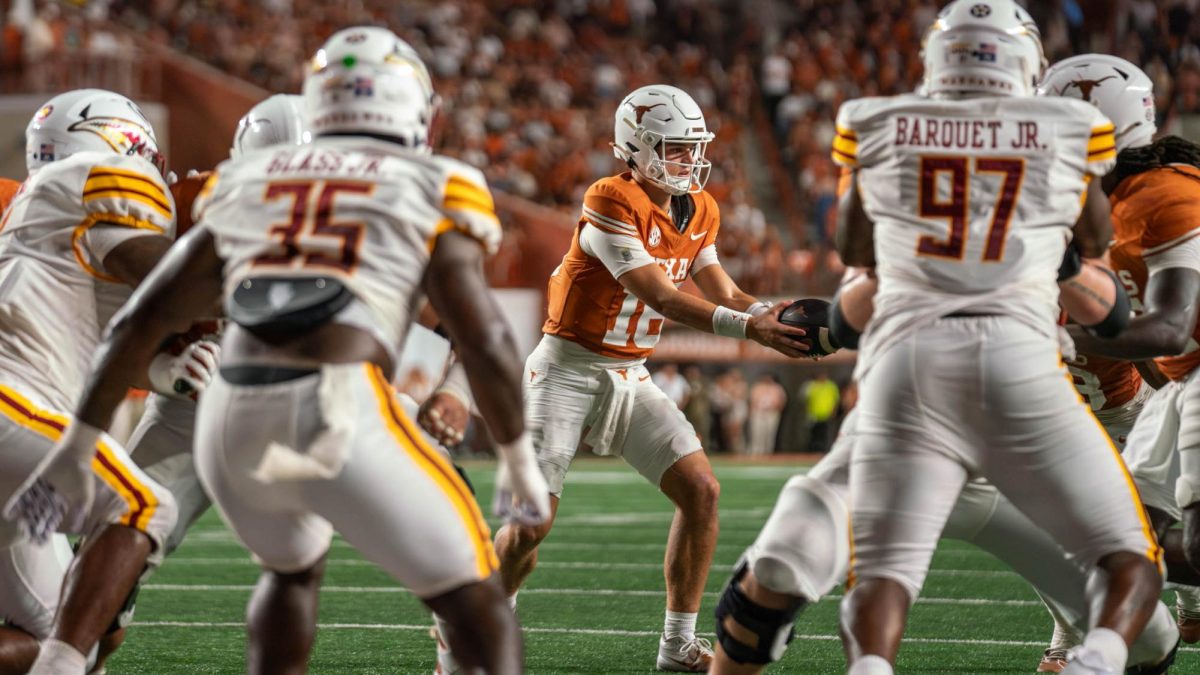 Redshirt freshman quarterback Arch Manning passes the ball off during Texas' game against ULM on Sept. 21, 2024. 