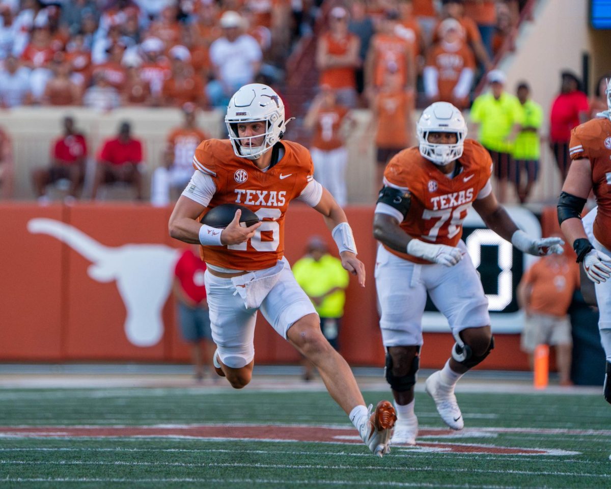 Redshirt freshman quarterback Arch Manning runs the ball for a first down during Texas' game against Mississippi State on Sept. 28, 2024. 