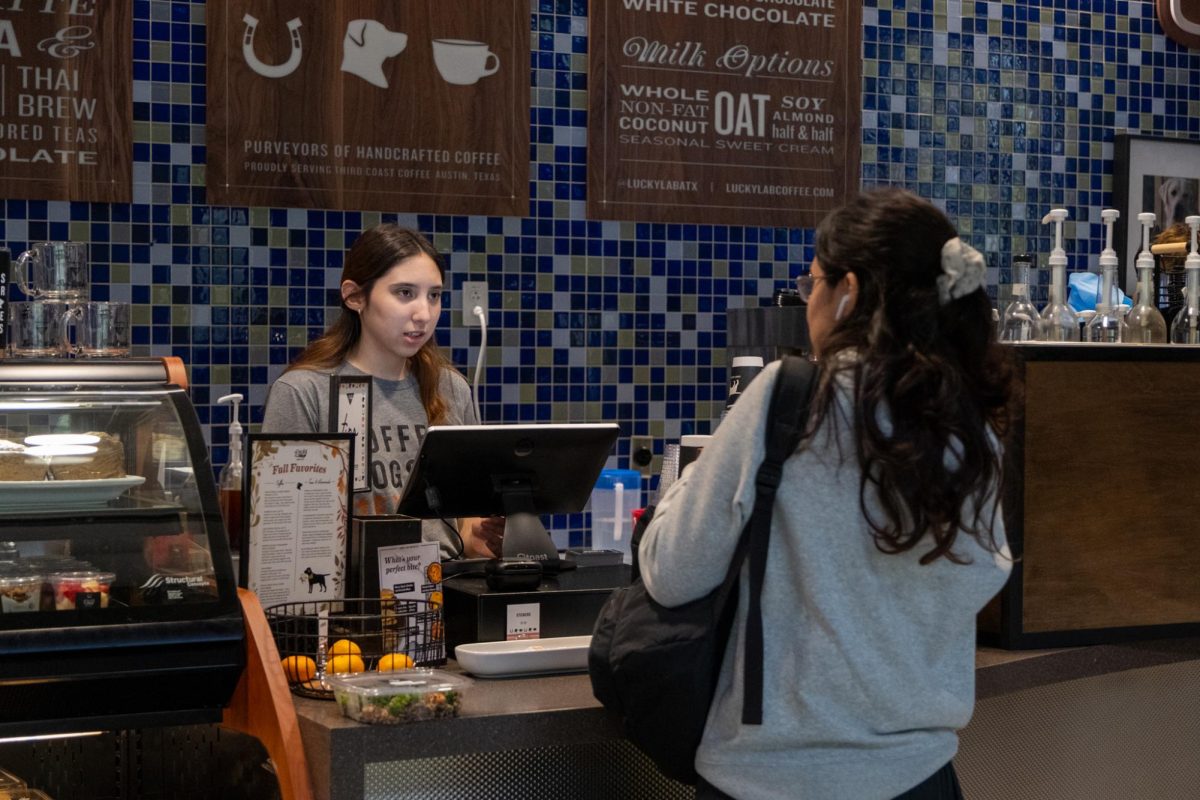 Barista Mia Cortina serves customers at the new Lucky Lab Coffee location at the G. B. Dealey Center for New Media on Sept. 5, 2024.