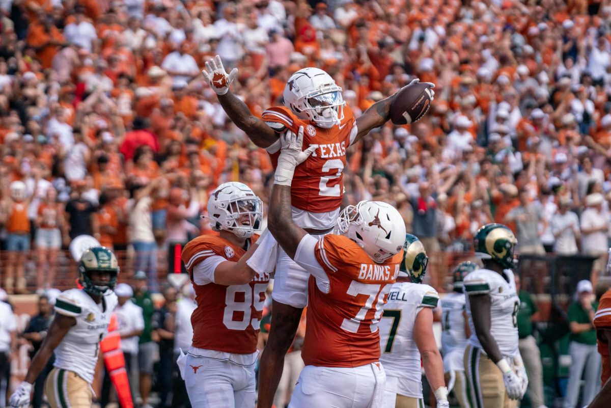 Junior wide receiver Matthew Golden celebrates a touchdown with his teammates during Texas' game against CSU on Aug. 31, 2024. 