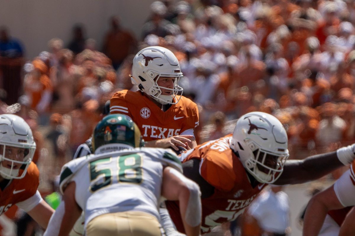 Starting quarterback Quinn Ewers catches a snap ball during Texas' game against CSU on Aug. 31, 2024. 