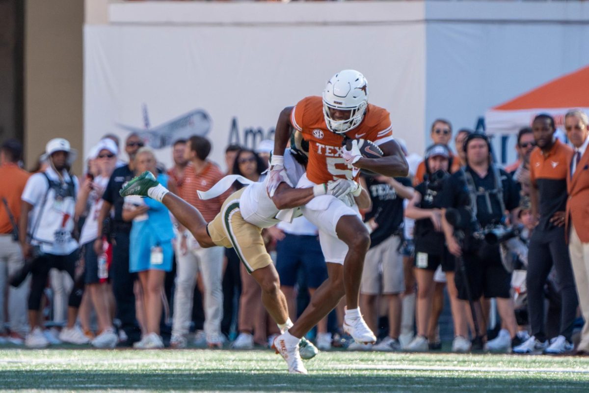 Freshman wide receiver Ryan Wingo fights a tackle during Texas' game against CSU on Aug. 31, 2024. 