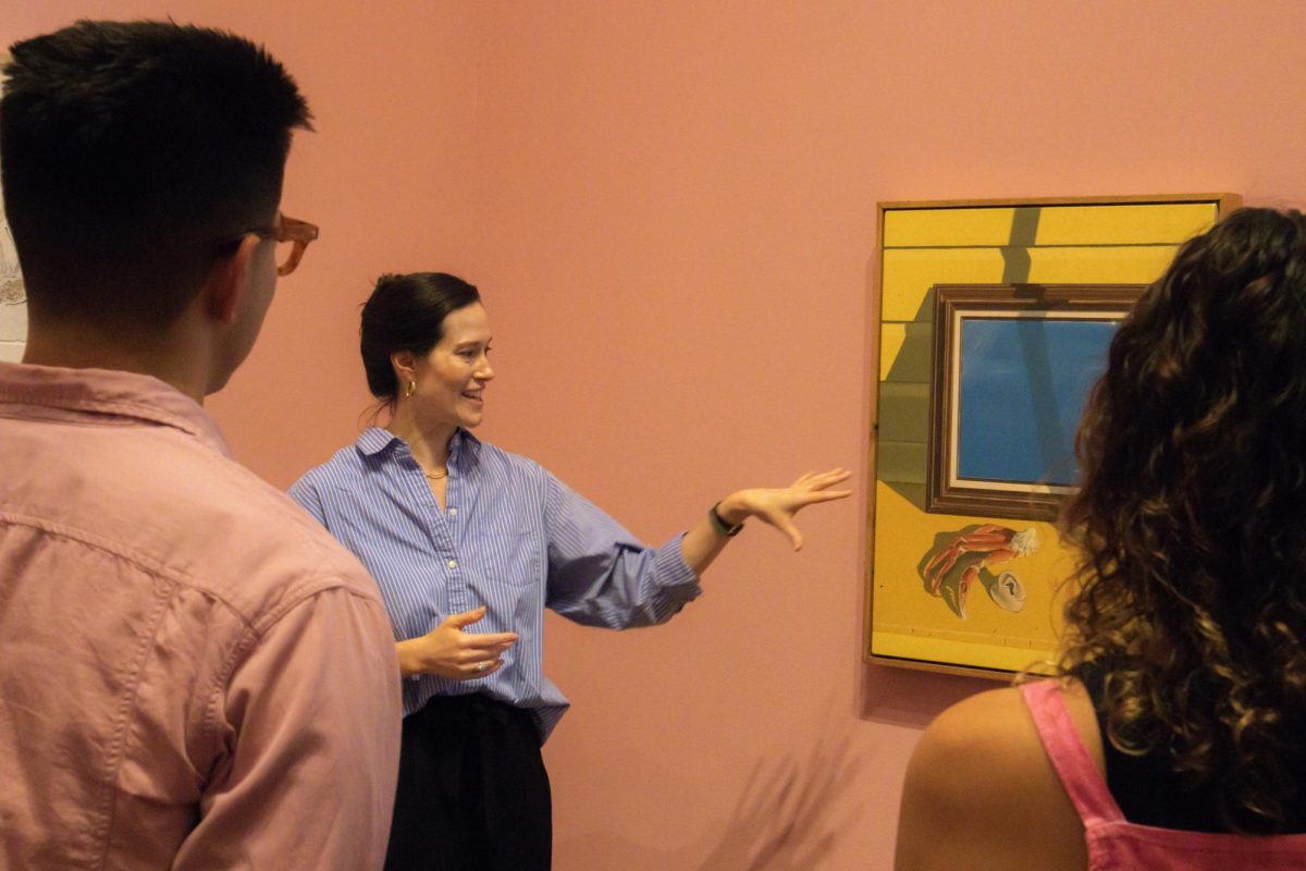 Associate Curator Claire Howard gives a tour of the "Long Live Surrealism!" Blanton Art Museum art exhibit on Sept. 6.