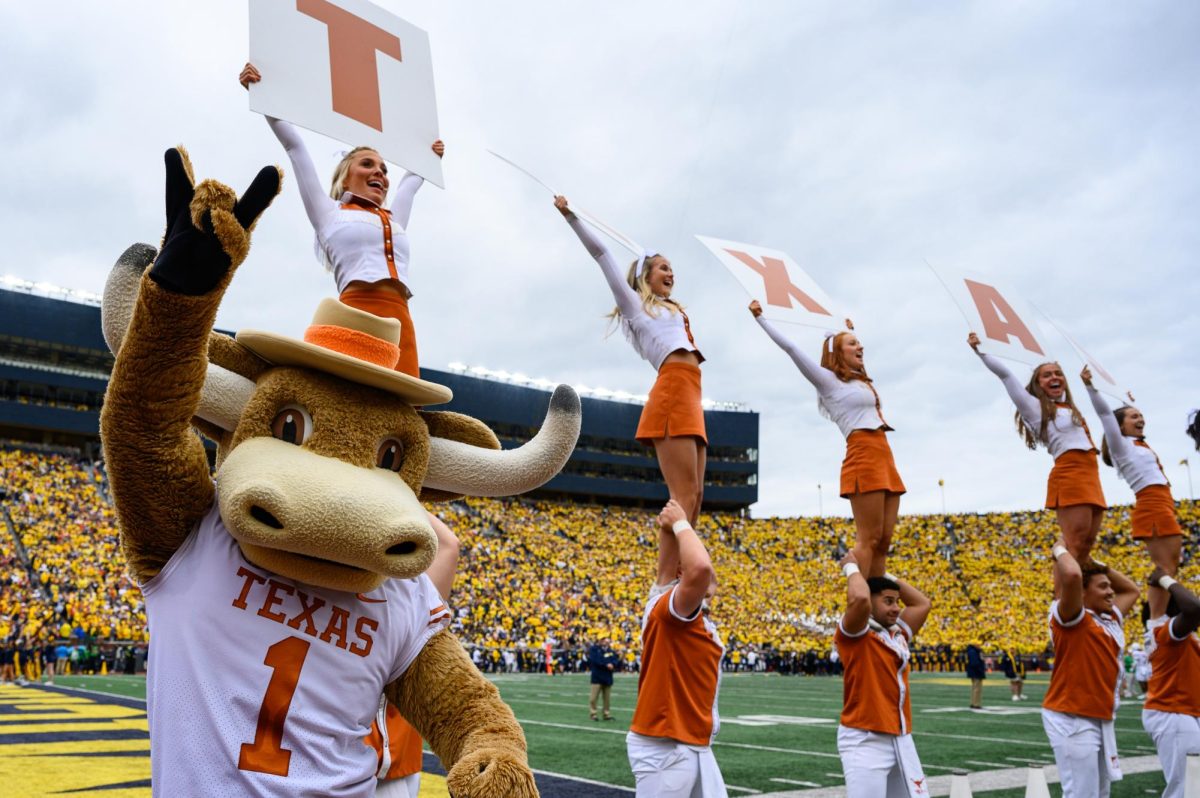 Texas mascot Hook 'em leads a cheer during the Texas vs. Michigan Football game at Michigan Stadium on Saturday.