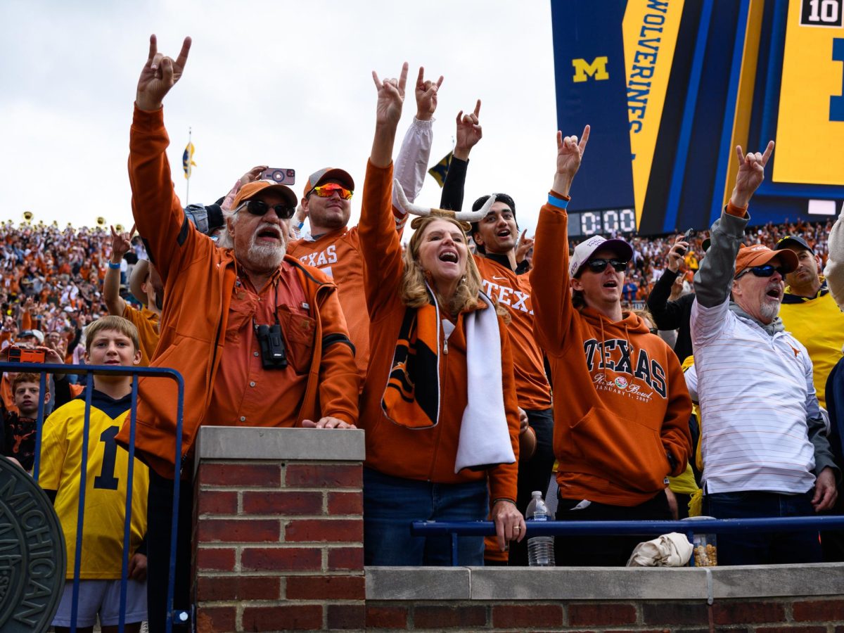 Texas fans celebrate after the Texas vs. Michigan Football game at Michigan Stadium on Saturday. Texas won 31-12.