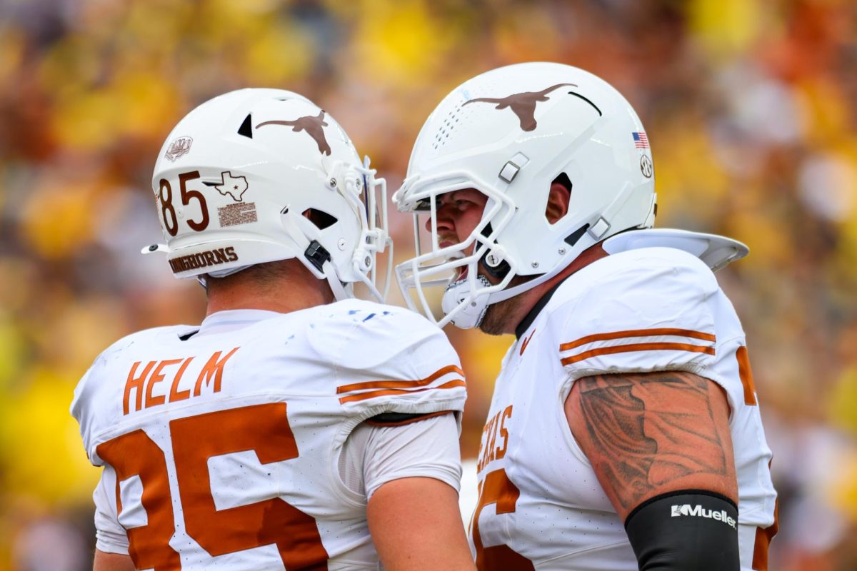 Texas tight end Gunnar Helm celebrates a touchdown with lineman Hayden Conner during the Texas vs. Michigan Football game at Michigan Stadium on Saturday.