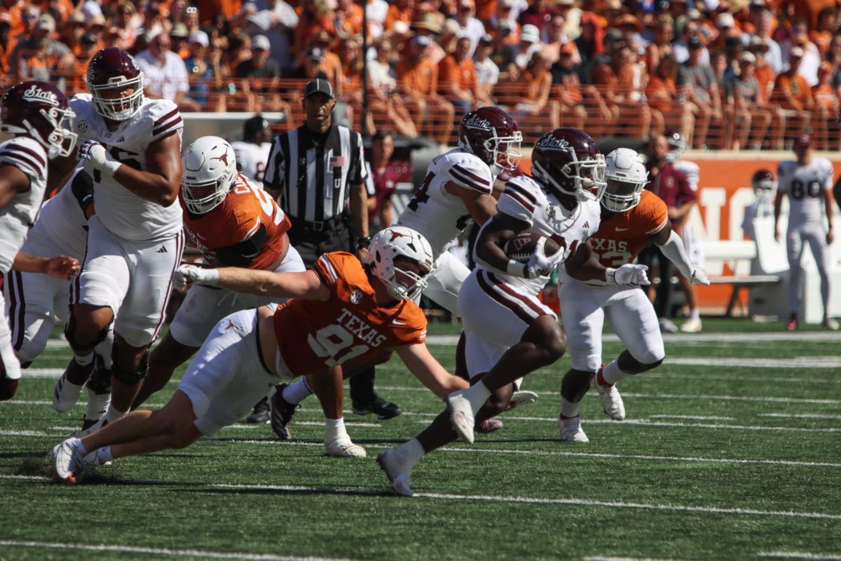 Edge Ethan Burke attempts to tackle Mississippi State runningback Davon Booth on Sept. 28, 2024.