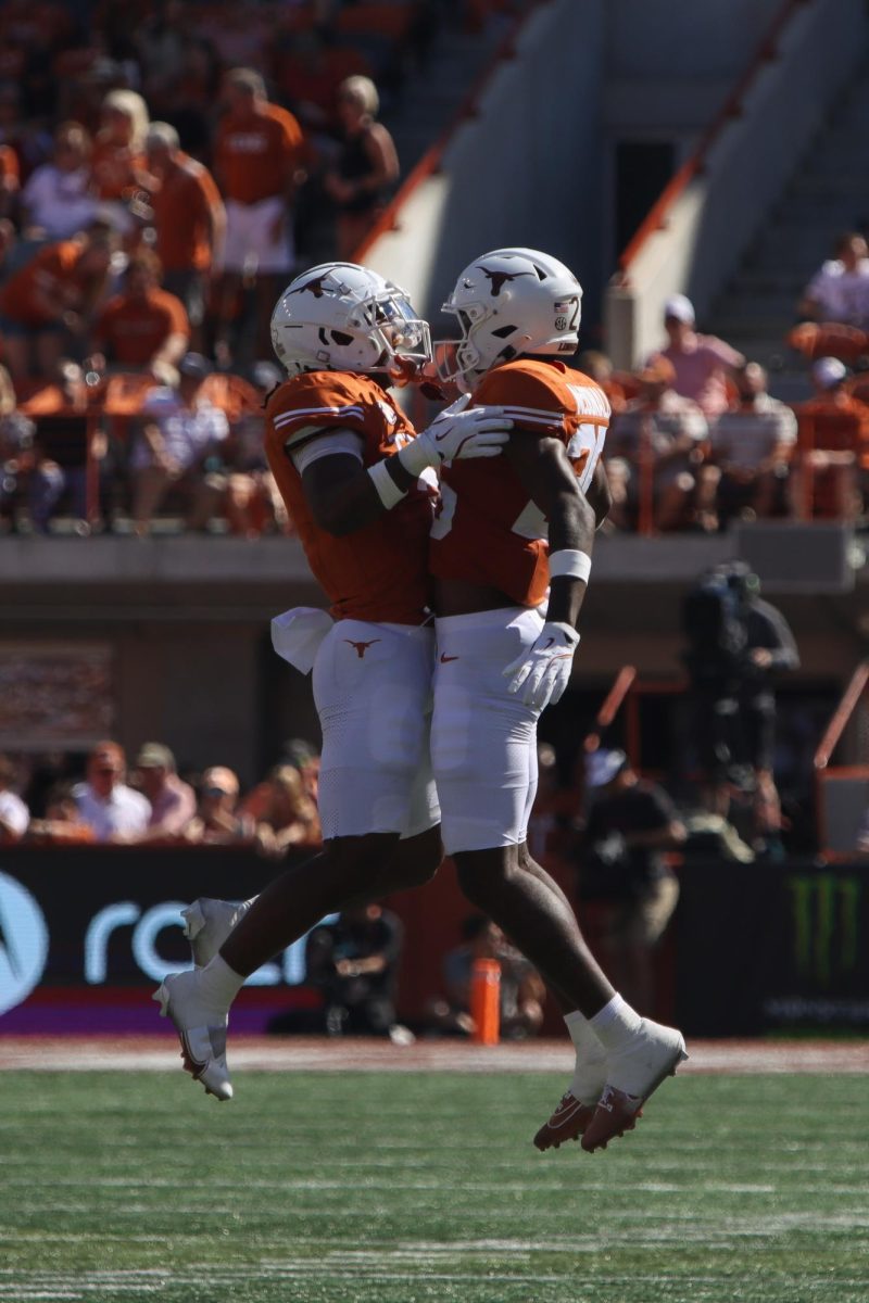 Wide Reciever Isaiah Bond and defensive back Jelani McDonald jump in celebration during Texas' game against Mississippi State on Sept. 28, 2024.