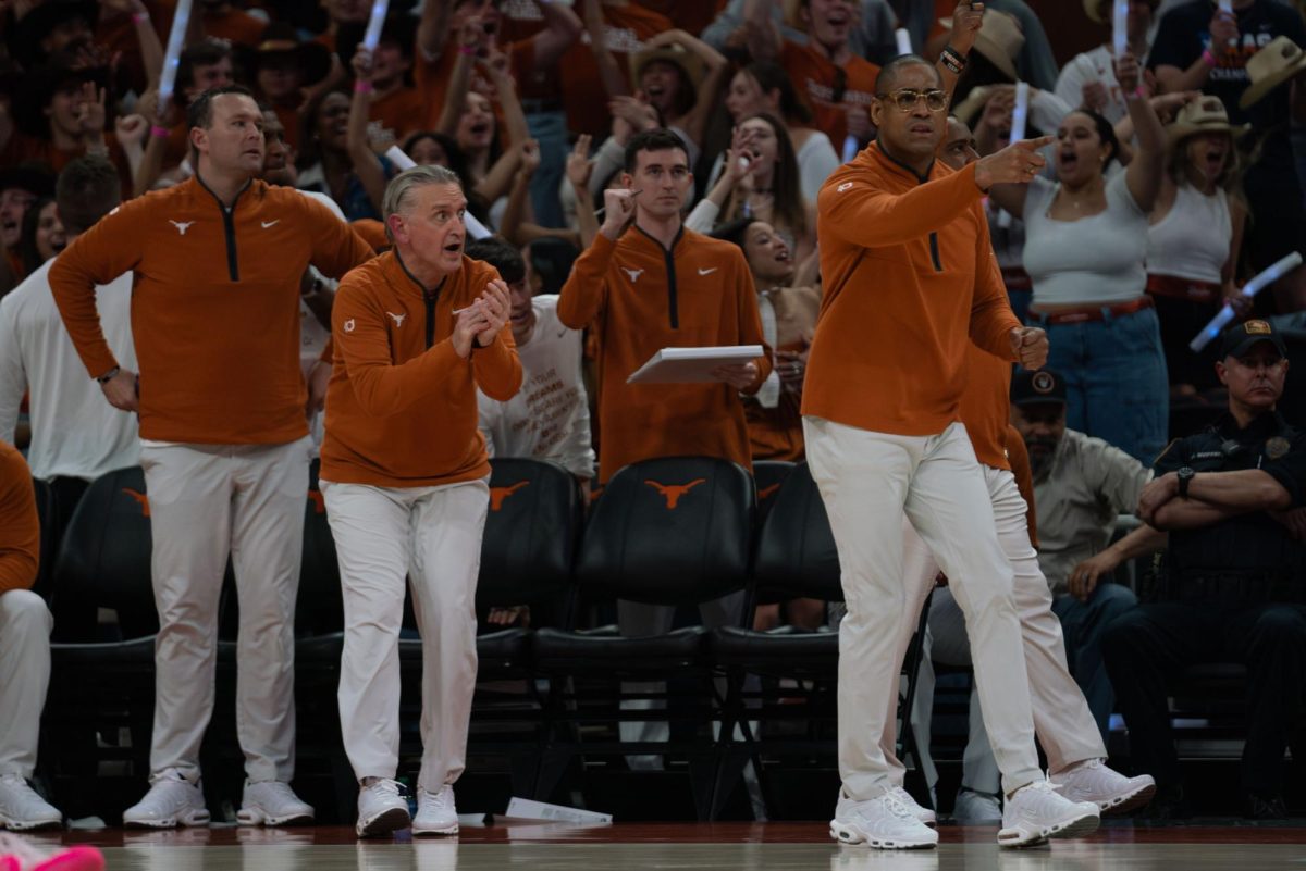 Head men's basketball coach Rodney Terry motions to his players during Texas' game against Iowa State on Feb. 6, 2024. 