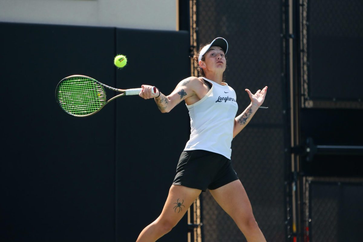 Vivian Ovrootsky hits the ball during singles play against OU on March 3, 2024.