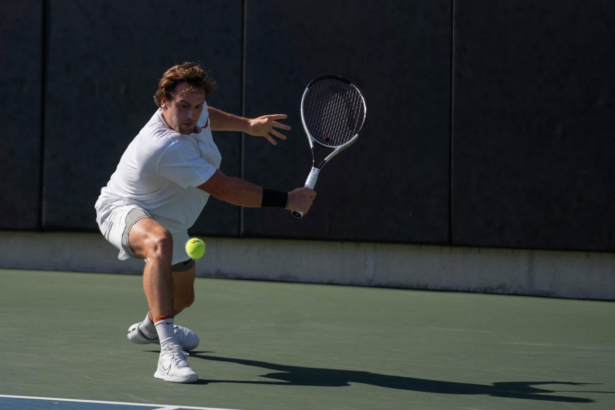 Pierre-Yves Bailly backhands the ball to Louis Bowden of Baylor University during a singles match on April 13, 2024. 