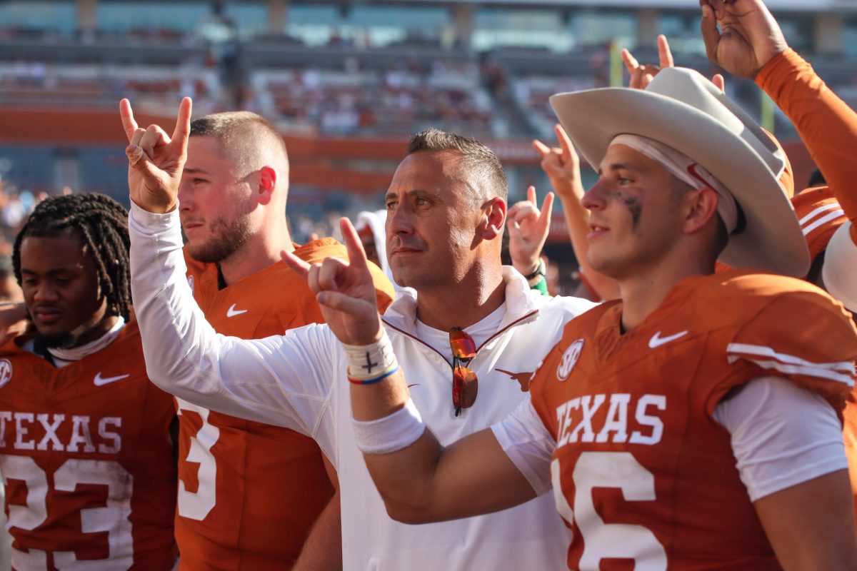 Texas football head coach Steve Sarkisian holds a horns up while "The Eyes of Texas" plays celebrating the win over Colorado State on Aug. 31, 2024.