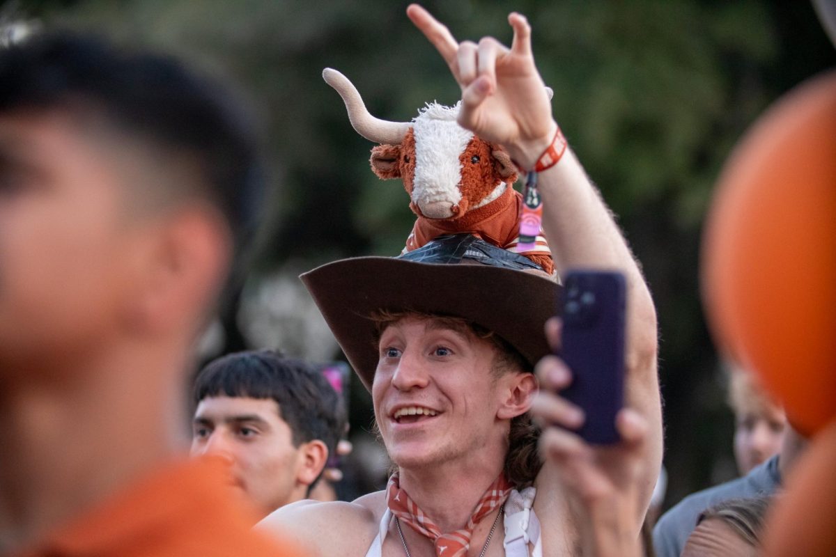 Bevo Hat Guy holds up the horns at the Texas Fight Rally on Oct. 9, 2024.