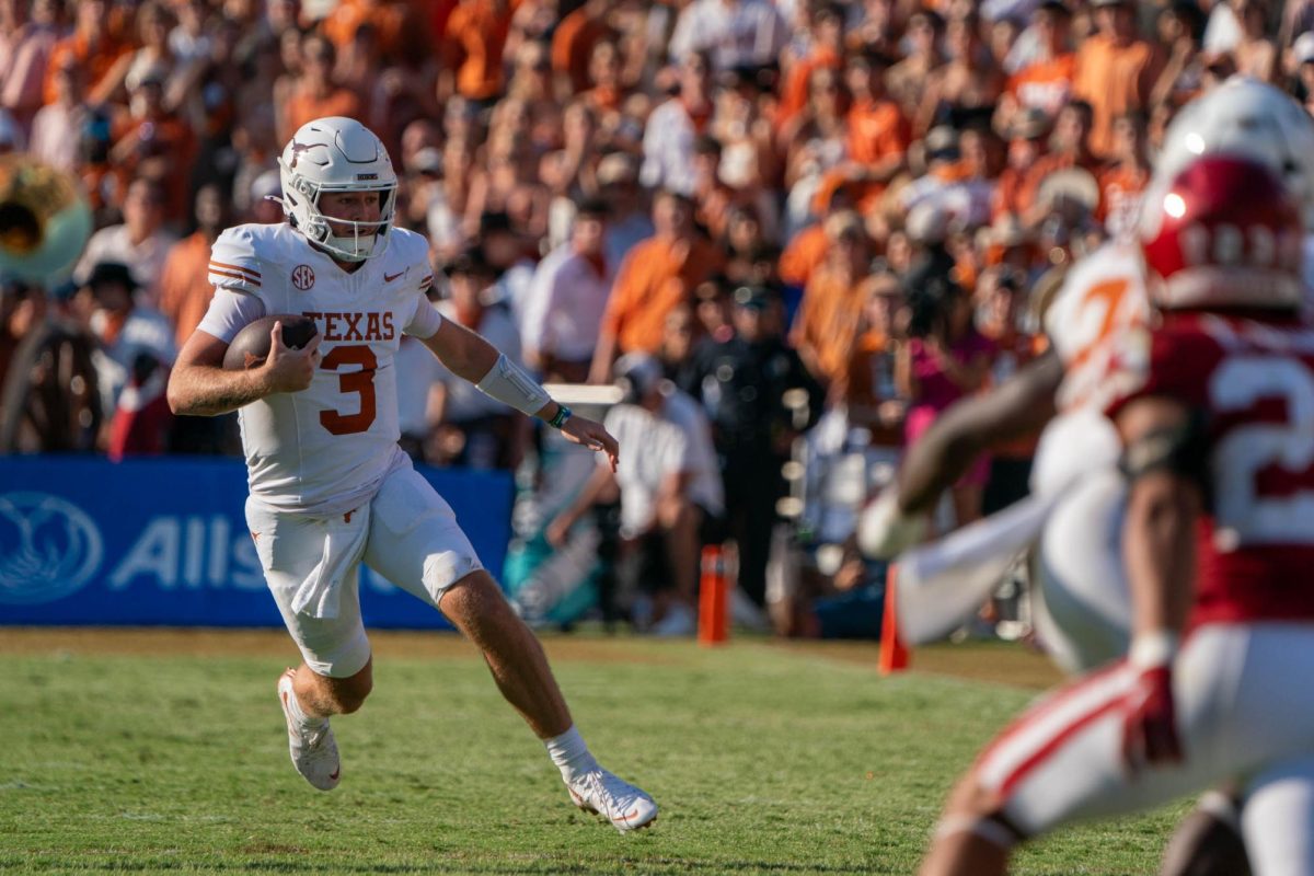 Quarterback Quinn Ewers runs the ball during the Red River Rivalry game on Oct. 12, 2024. 