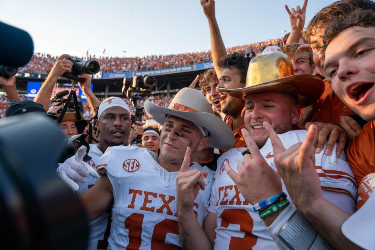 Quarterback Quinn Ewers poses with the golden hat after Texas' win against Oklahoma on Oct. 12, 2024. 