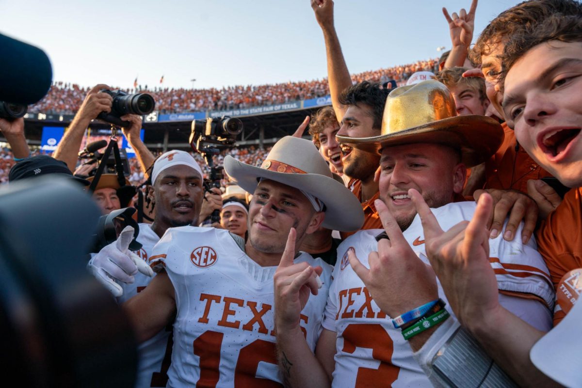 Quarterback Quinn Ewers poses with the golden hat after Texas' win against Oklahoma on Oct. 12, 2024. 