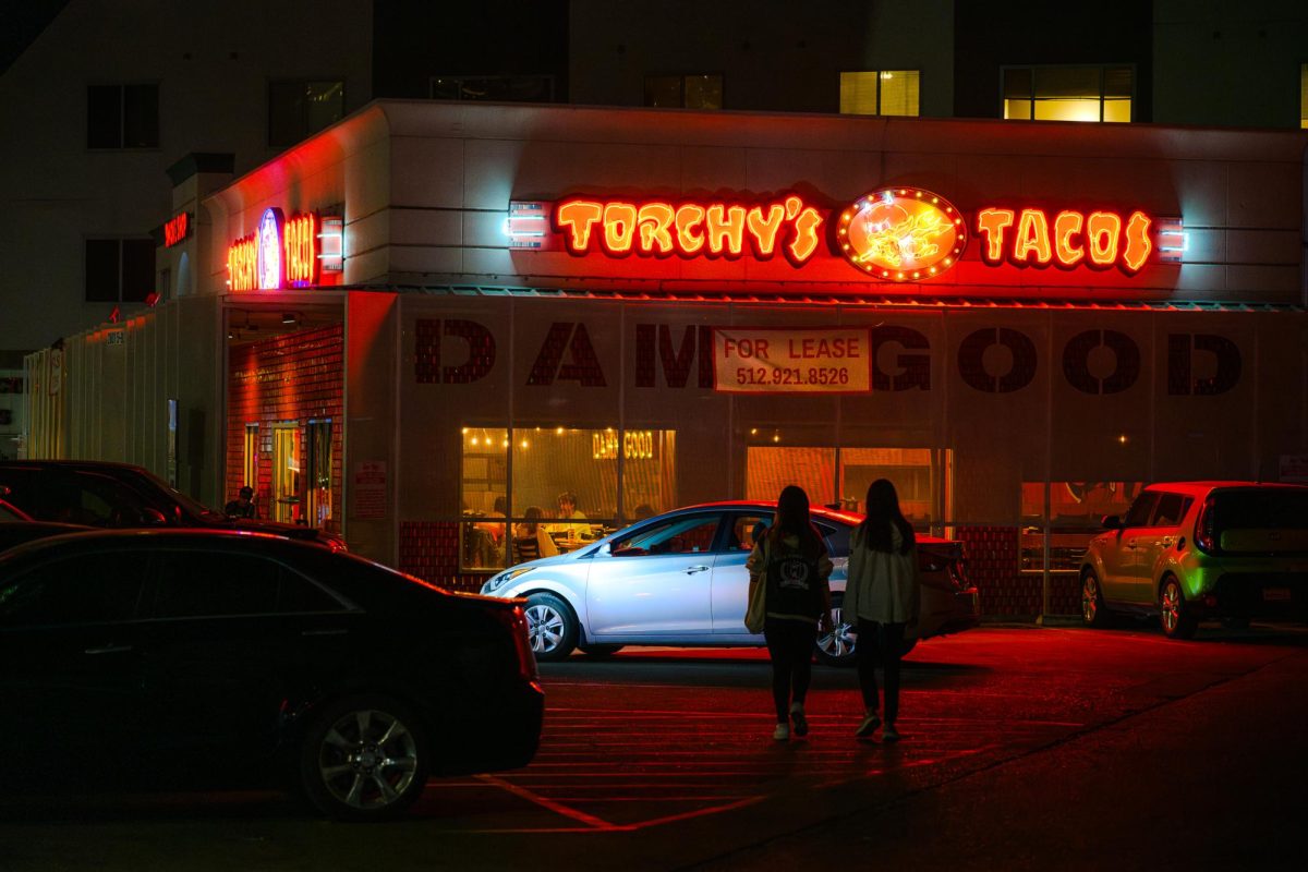 A "For Lease" sign is draped on Torchy's Tacos at the corner of 28th and Guadalupe streets on Oct. 17, 2024 as the restaurant is set to close after 16 years of service.