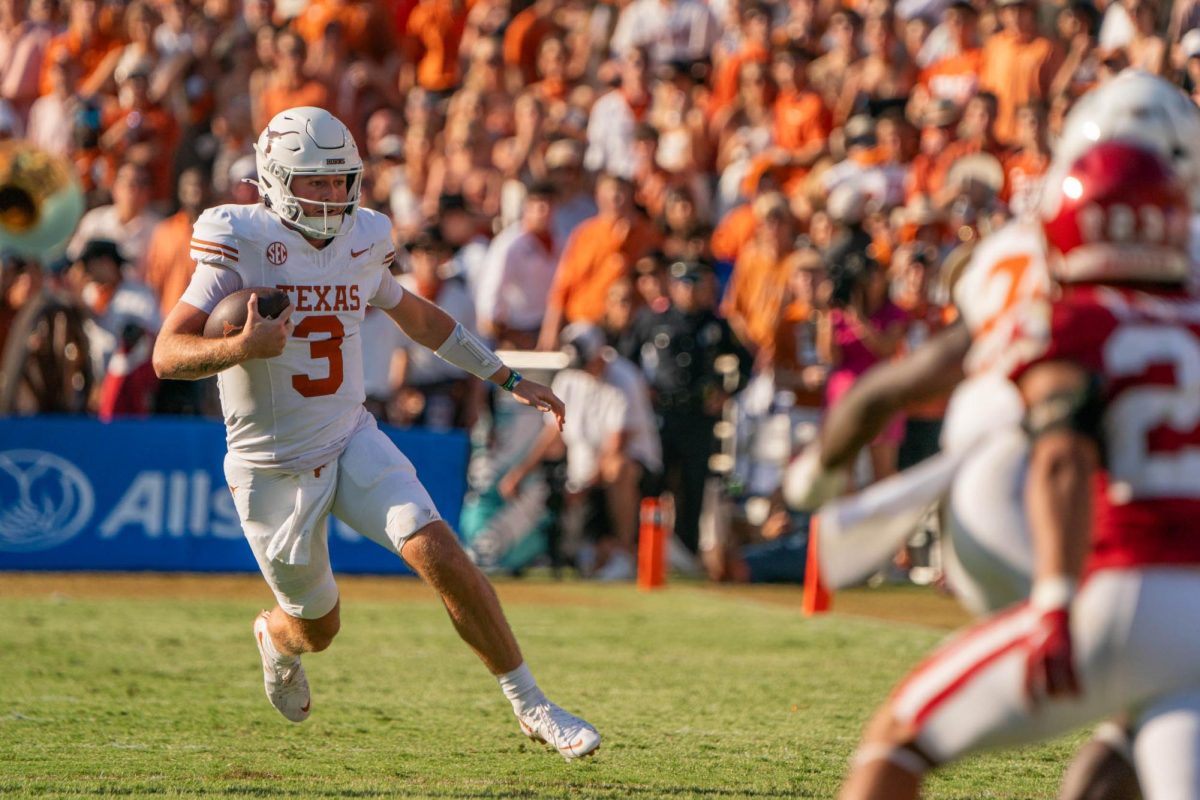 Quarterback Quinn Ewers runs the ball furing the Red River Rivalry game on Oct. 12, 2024.