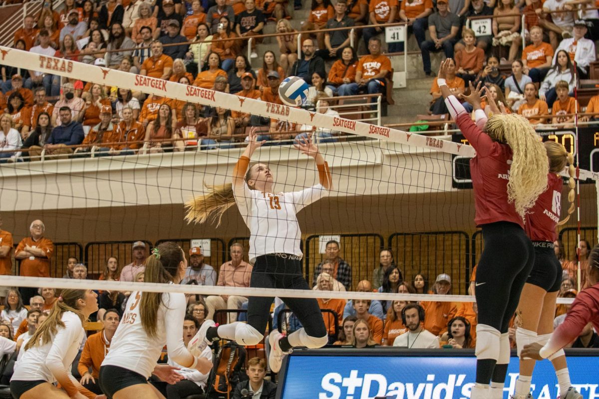 Jenna Wenaas jumps to receive the incoming ball from Arkansas on Oct. 19, 2024. The Longhorns swept the Razorbacks by winning 3 consecutive sets for head coach Jerritt Elliott’s 600th career win at Texas.