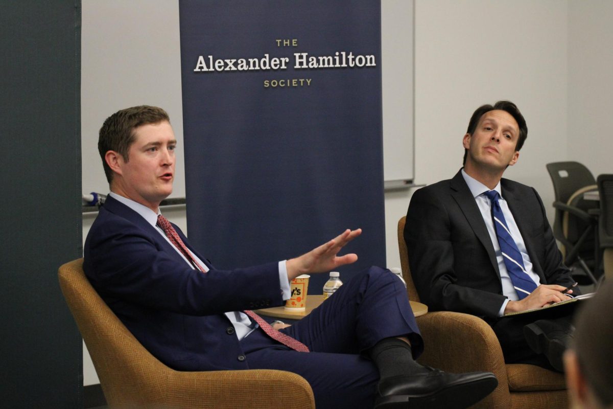 Alexander Gray (left), the former chief of staff of the White House National Security Council, responds to a question from an audience member at a fireside chat hosted by the Strauss Center at the Lyndon B. Johnson School of Public Affairs on Oct. 22, 2024. The chat, moderated by Strauss Center Director Adam Klein (right), focused on foreign policy in a potential second Donald Trump term.