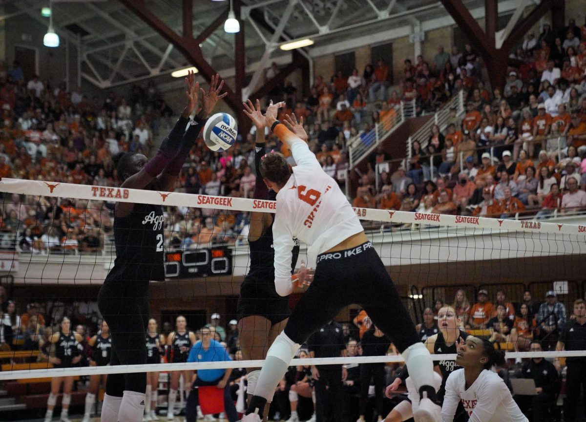 Outside hitter, Madisen Skinner spikes home a point during the Longhorns five set loss to the Texas A&M Aggies on Oct. 23, 2024. 