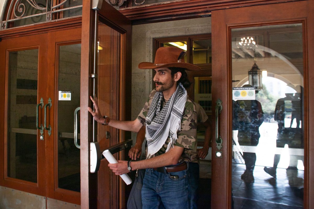 Arshia Papari leaves UT Tower after being denied access to hand President Jay Hartzell the Students for a Democratic Society demands letter on Oct. 30, 2024.