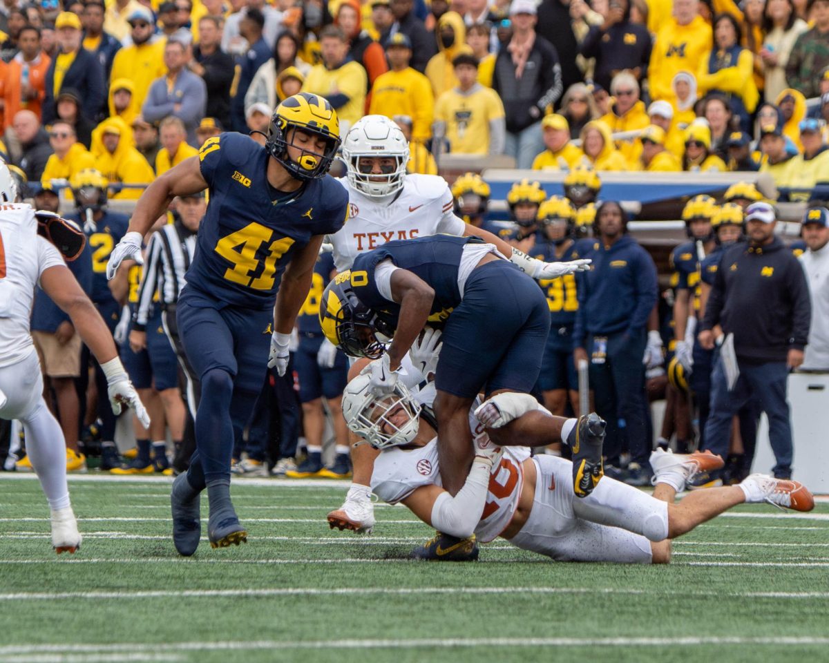 Defensive back Michael Taaffe tackles a Michigan player during Texas' game in The Big House on Sept. 7, 2024. 