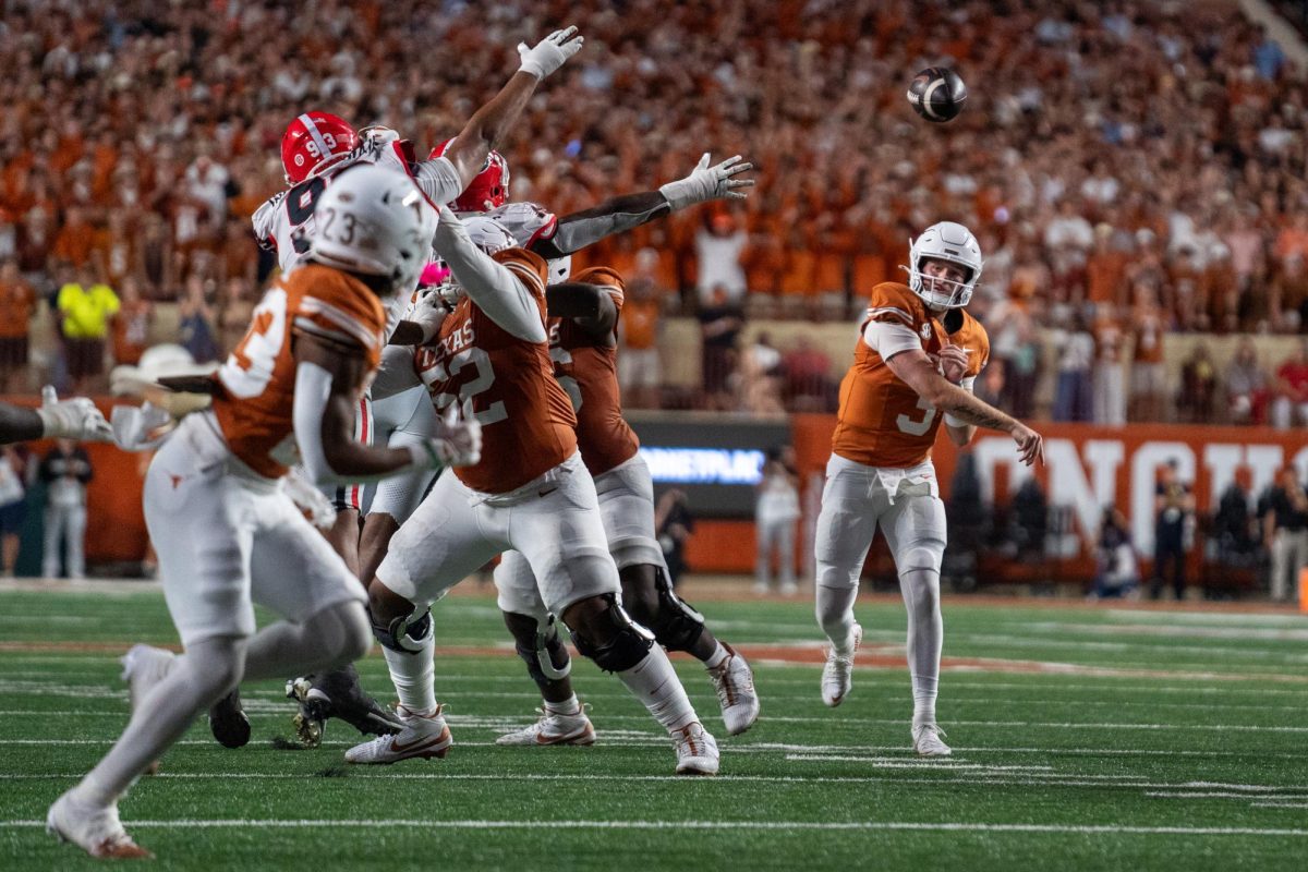 Quarterback Quinn Ewers passes the ball to running back Jaydon Blue during Texas' game against Georgia on Oct. 19, 2024. 