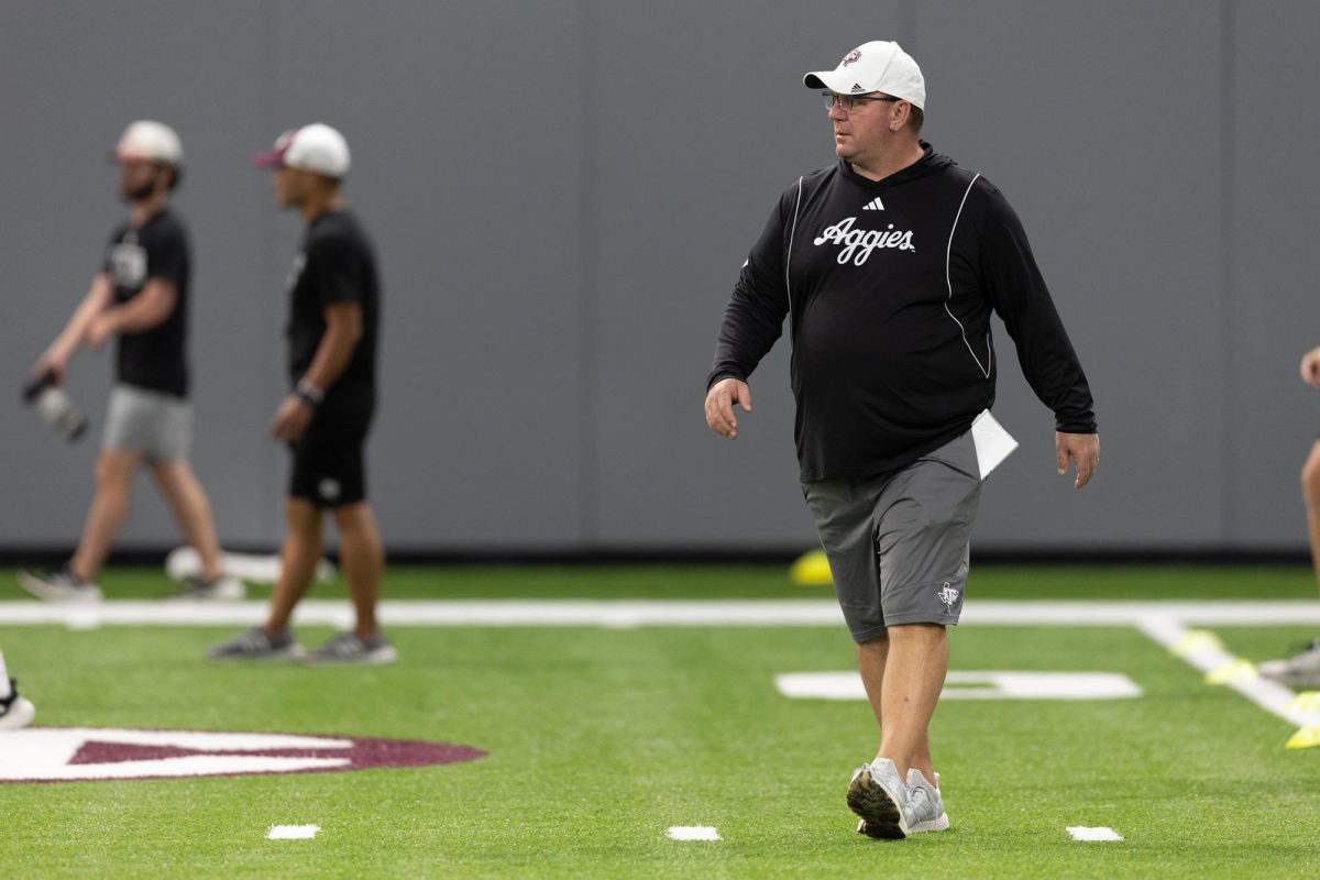 Texas A&M head coach Mike Elko watches his players run drills during the second day of fall football practice in the Coolidge Football Performance Center on August 1, 2024.