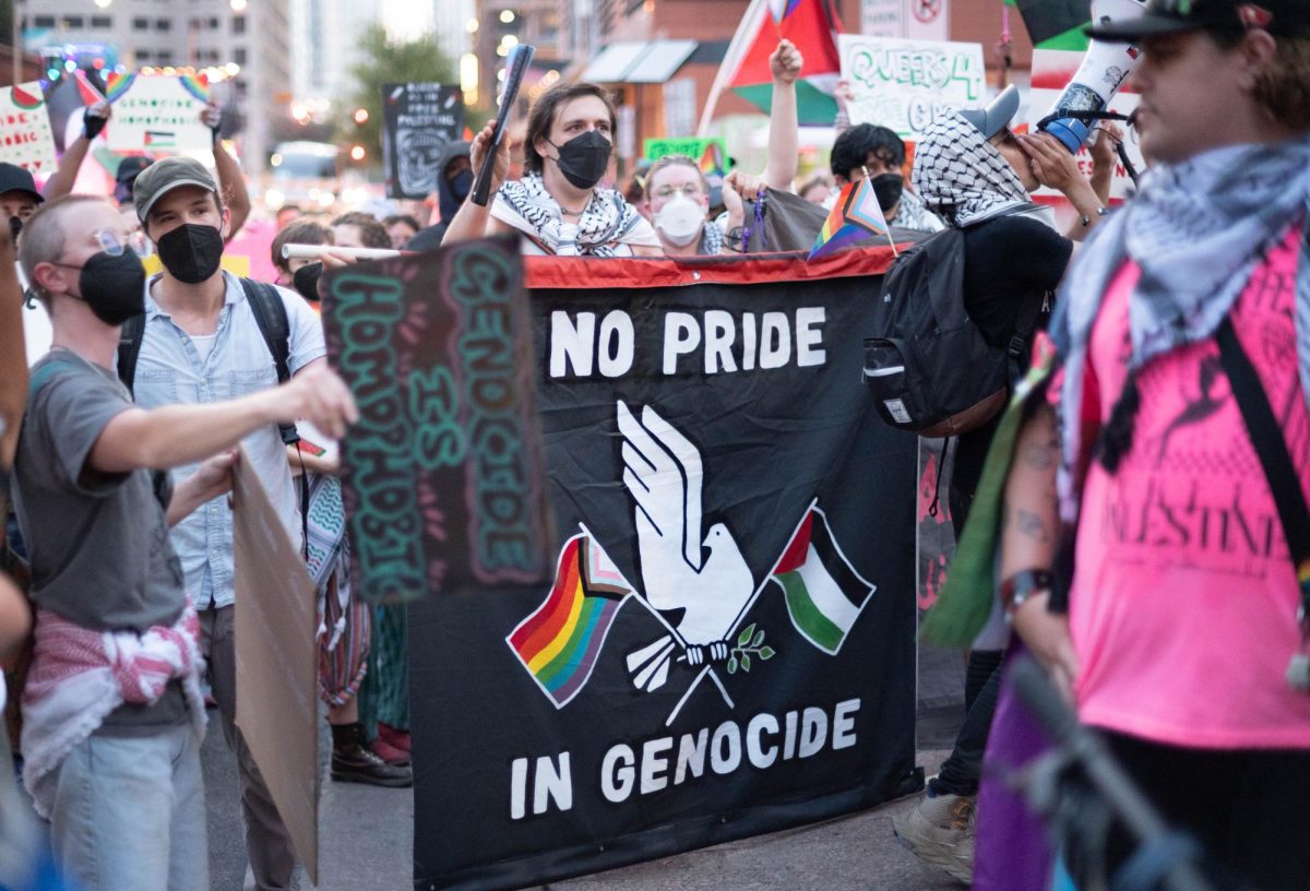 Pro-Palestinian demonstrators gather downtown near the Austin Pride Parade on Aug. 10, 2024 to protest pinkwashing, a strategy to draw attention to LGBTQ+ freedoms instead of damaging actions.