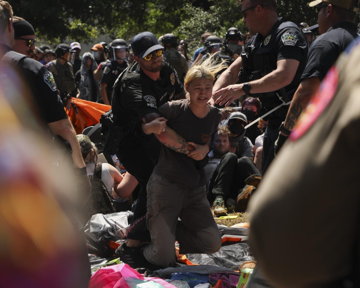 A protester is arrested during an attempted encampment on the University of Texas' Main Mall on April 29, 2024.