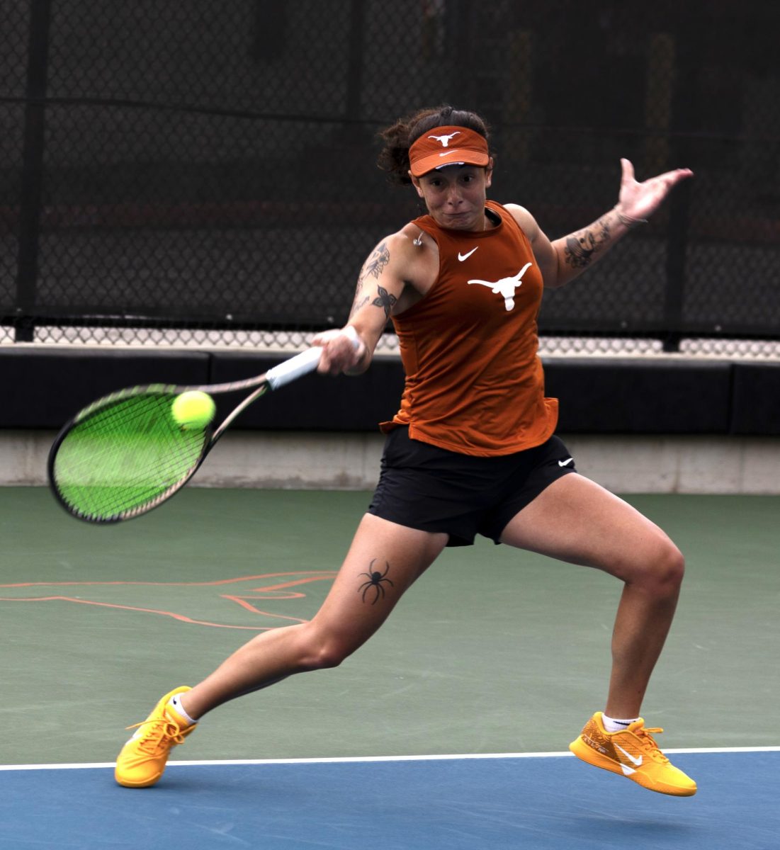 Redshirt sophomore Vivian Ovrootsky hits the ball in a match against Kansas State University on March 24, 2024.