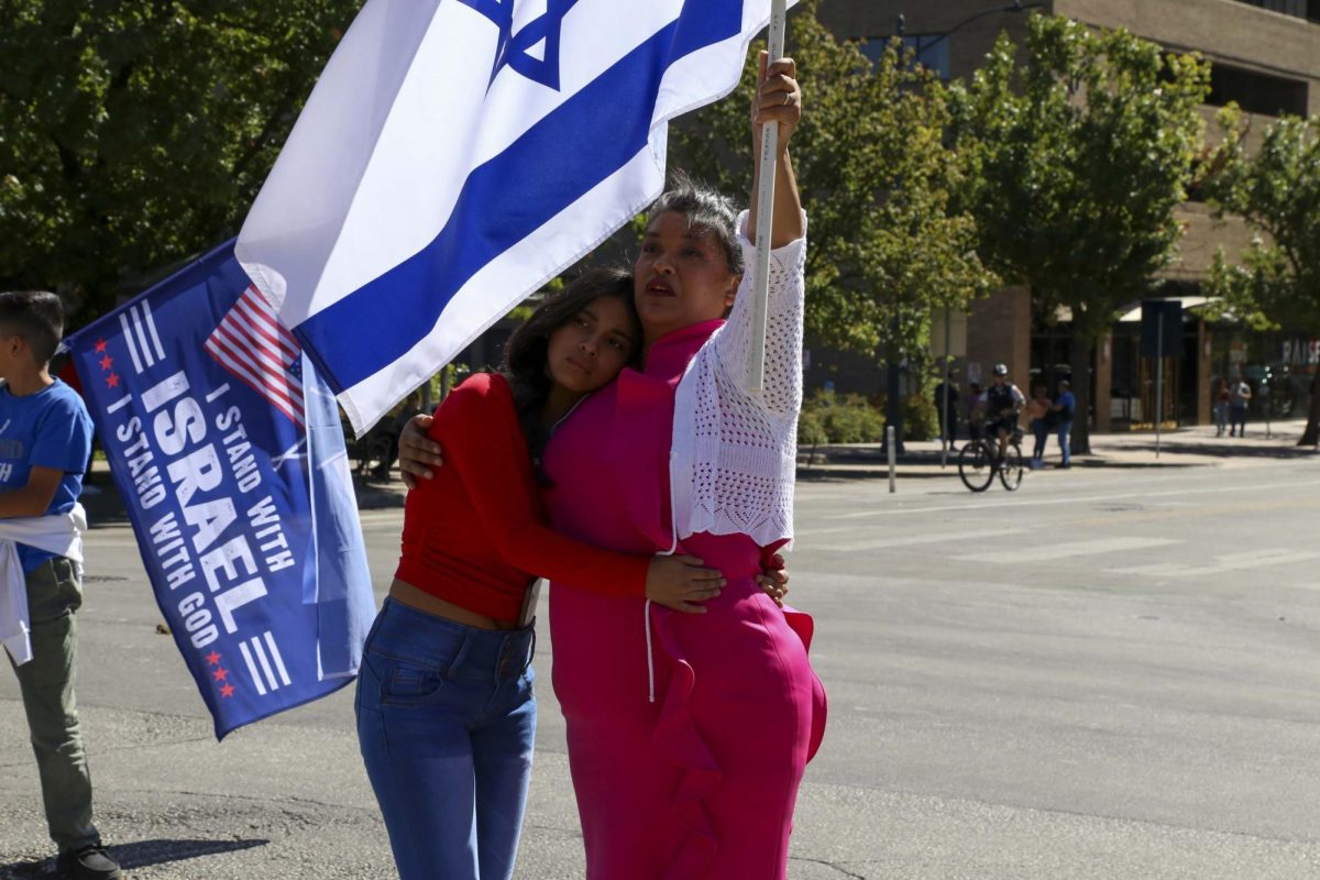 A mother and daughter stand in front of the Texas Capitol in support of Israel on Oct. 15, 2023.