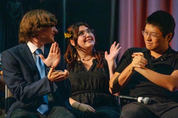 Sam Brashesr (left) and Zhouli Xie (right) applaud winning contestant Stella Frasier (middle) after judges Ben Kompare and Denny Sebold make the tie breaking call during the comedy game show, Masters of None on Monday Sept 30, 2024.